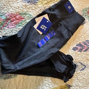 Black leggings with ruffles on bottom